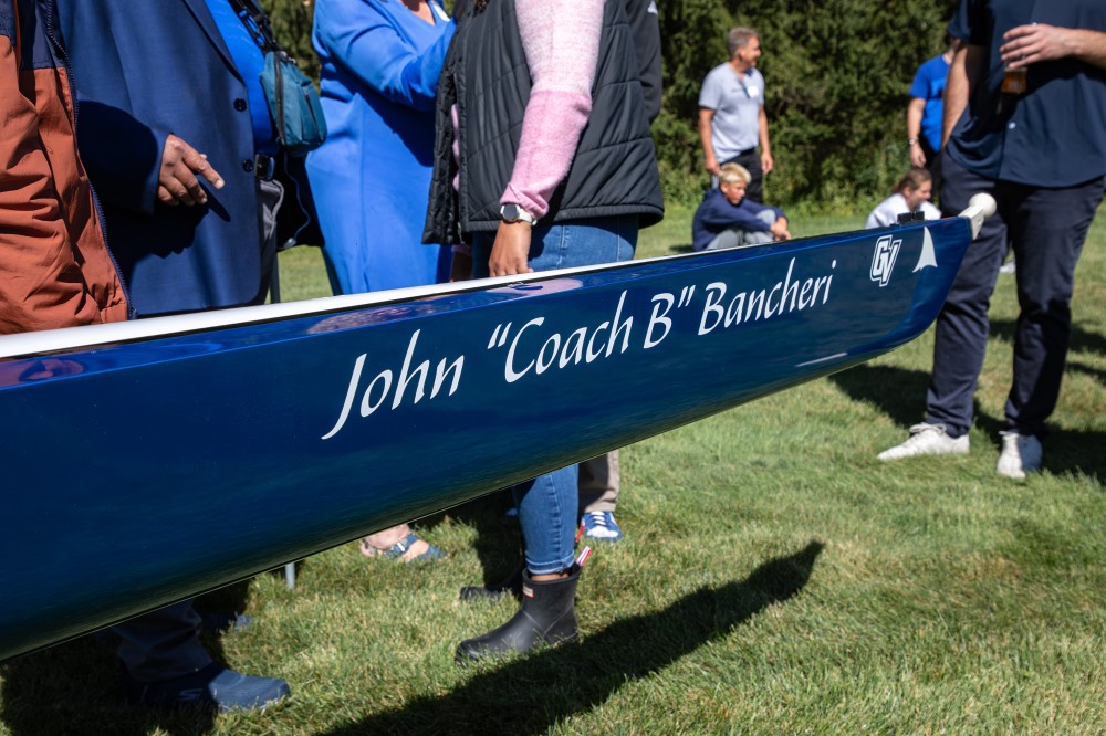 John "Coach B" Bancheri written on side of boat